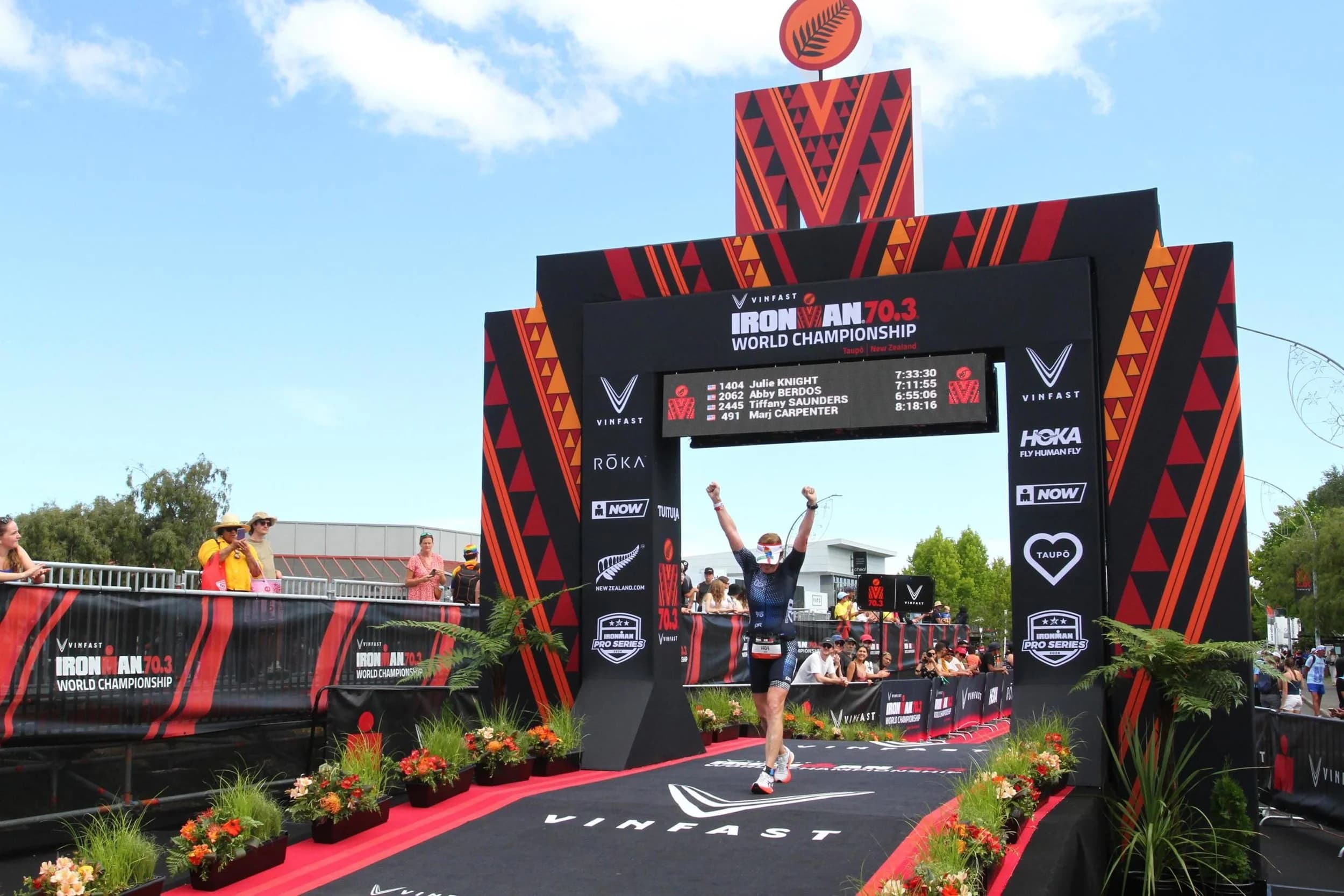 Julie Knight crossing the finish line of the Ironman 70.3 World Championships in Taupō, New Zealand, 2024